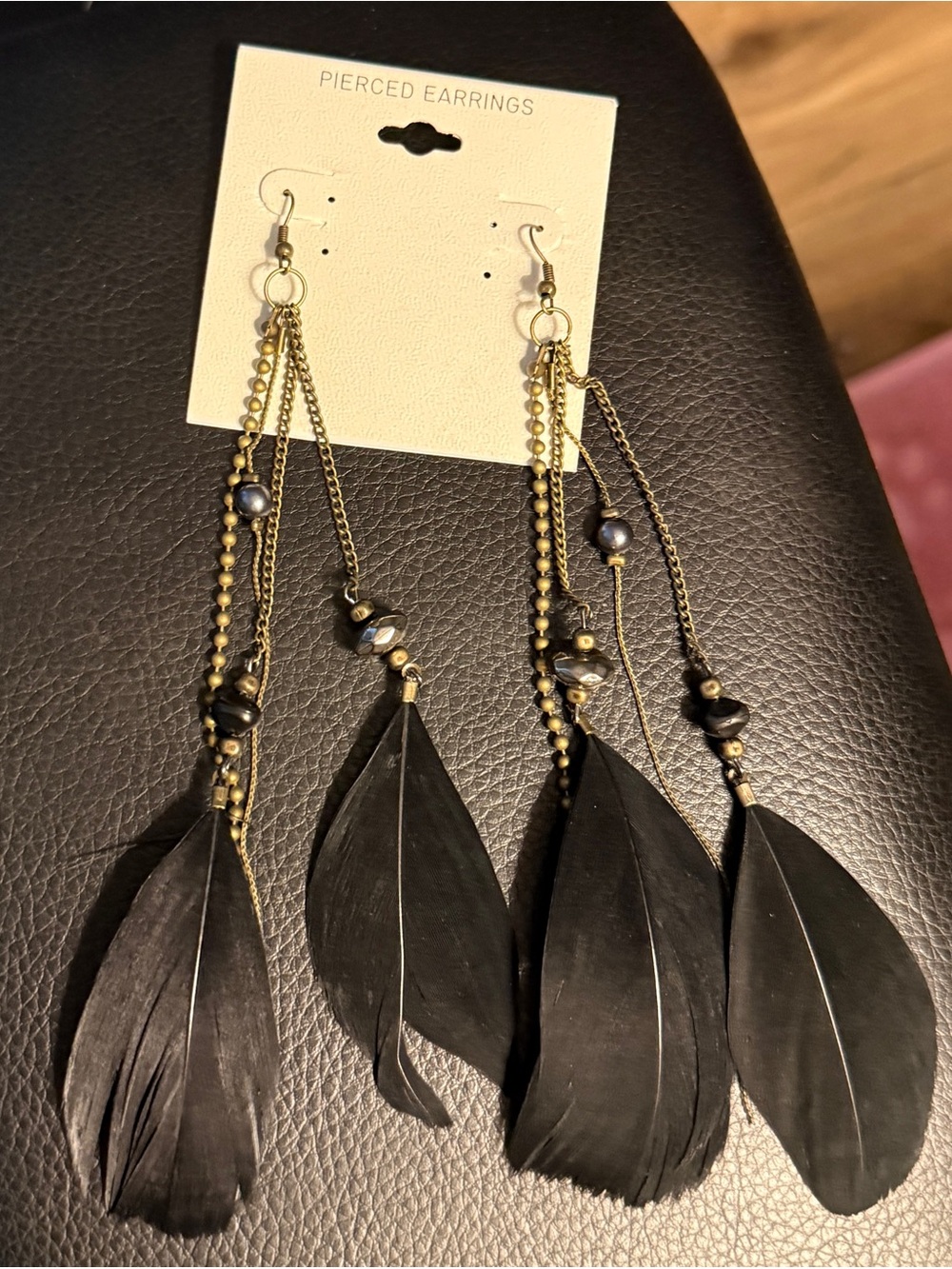 Black Feather Dangle Earrings with Gold Accents